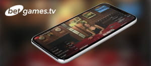 Ein Smartphone mit den BetGames.TV Live Spielen.