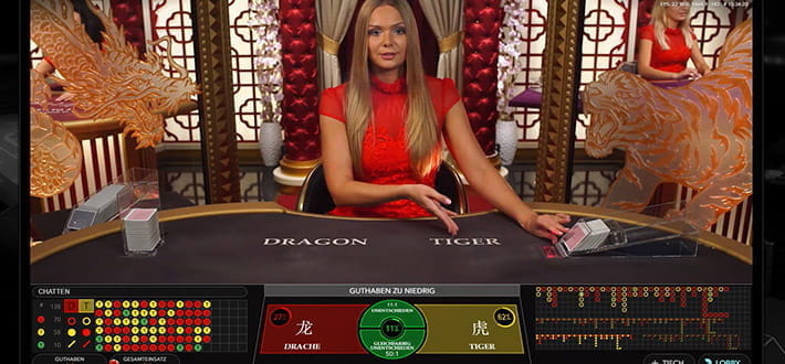 Live Dragon Tiger Spieltisch im Live Bereich des Euro Palace Casinos. Der freundliche Dealer ermuntert die Casino Gäste, am Spiel teilzunehmen.