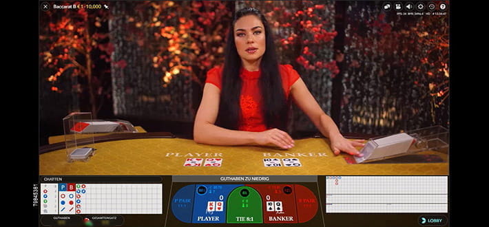 Live Baccarat von Evolution Gaming im Live Bereich des Mega Casinos. Vier Spielkarten liegen bereits offen, der Dealer zieht gerade die nächste Karte.