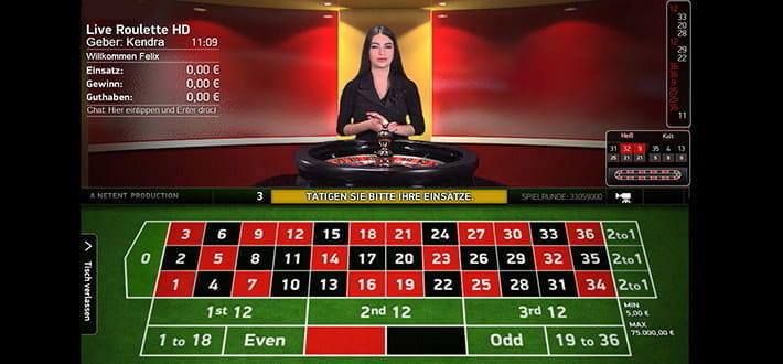 Ein privater Live Roulette HD Spieltisch von NetEnt im RIZK Live Casino. Das Setztableau nimmt die gesamte untere Bildhälfte ein. Mittig oben steht der Dealer hinter dem Roulettekessel. Rechts davon ist ein großes Banner mit dem Schriftzug RIZK zu sehen.