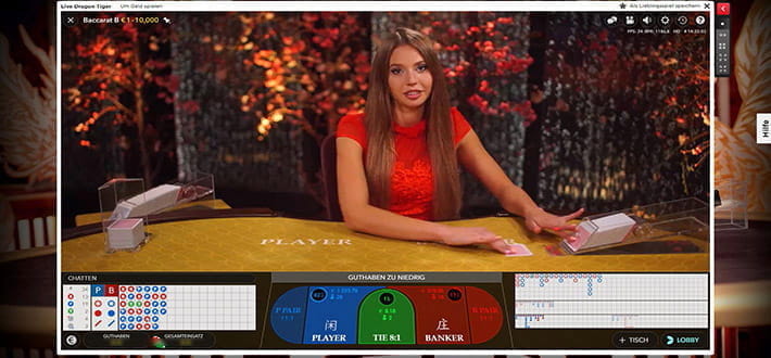 Evolution Gaming Live Baccarat Spieltisch im Royal Panda Live Casino. Der Dealer zieht gerade die zweite Karte.