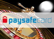 Das Bild zeigt ein typisches Casinosymbol und den Schriftzug paysafecard.