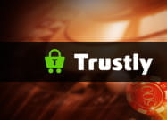 Das Trustly Logo vor einer Internet Casino Illustration.