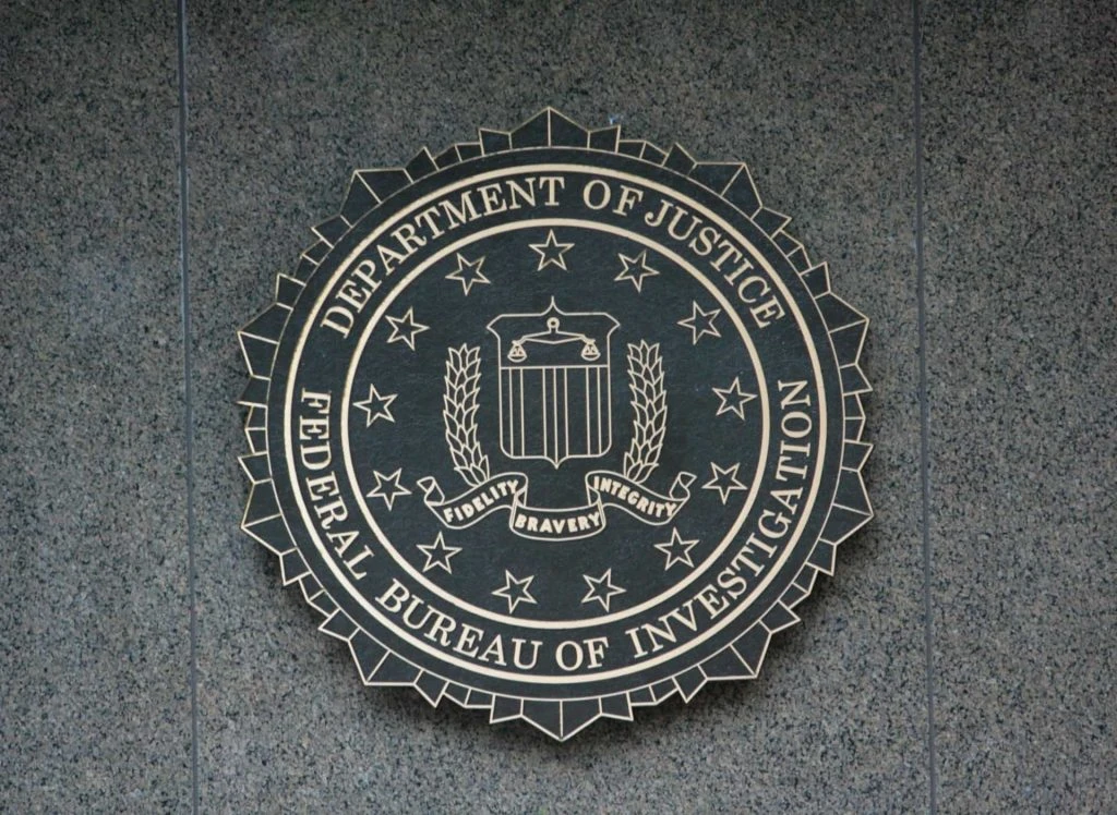 Siegel des US-Justizministeriums und des FBI