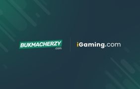 Die Logos des Wettportals Bukmacherzy.com und der iGaming.com Group nebeneinander auf dunkelgrünem Hintergrund.